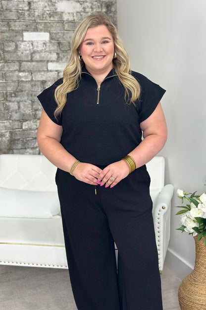 Two piece black set with a half zip mock neck top