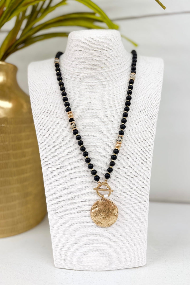 Long black necklace with hammered disk beads