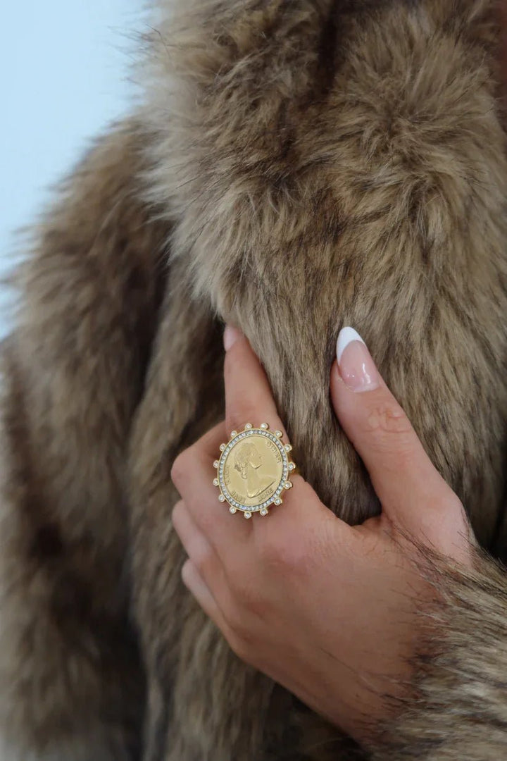 Gold coin ring set with sparkling stones