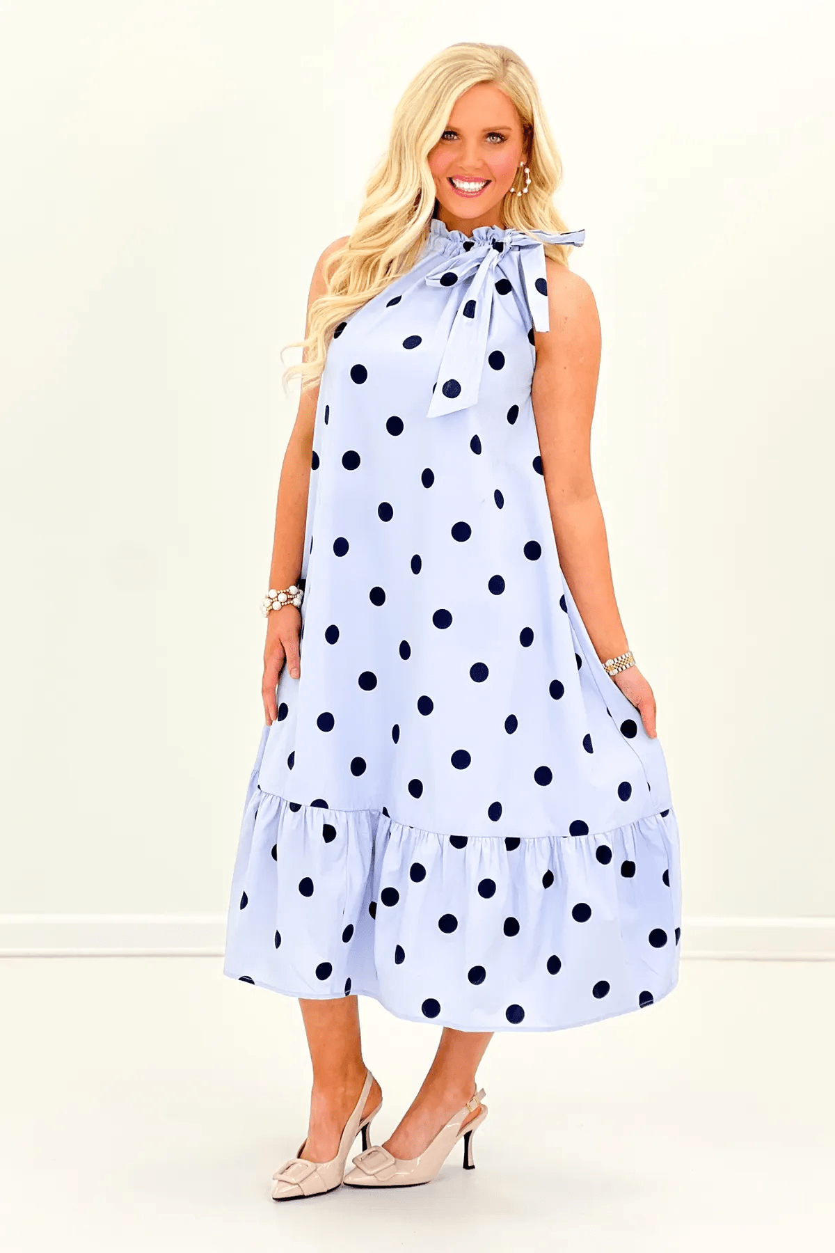 Blue sleeveless midi dress with a ruffle neck tie