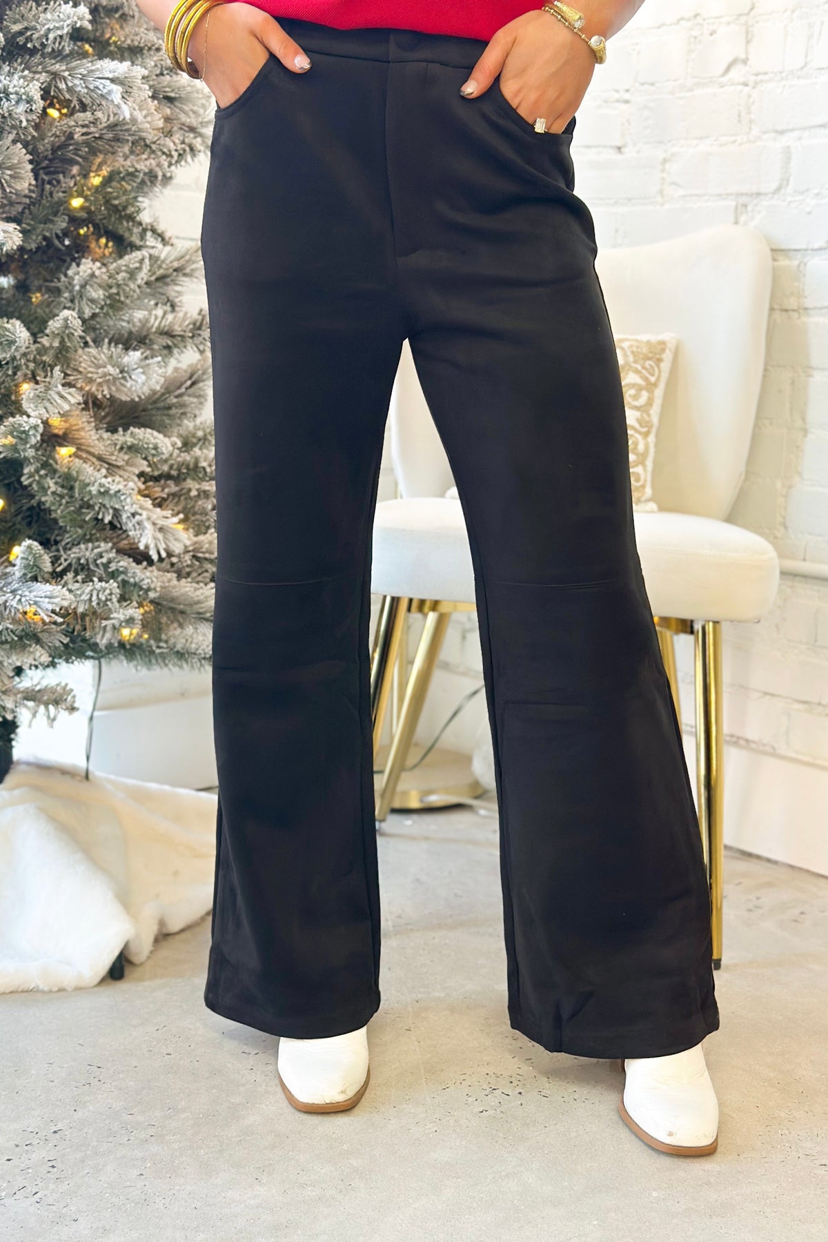Black suede straight-leg pants with front pockets and relaxed wide fit