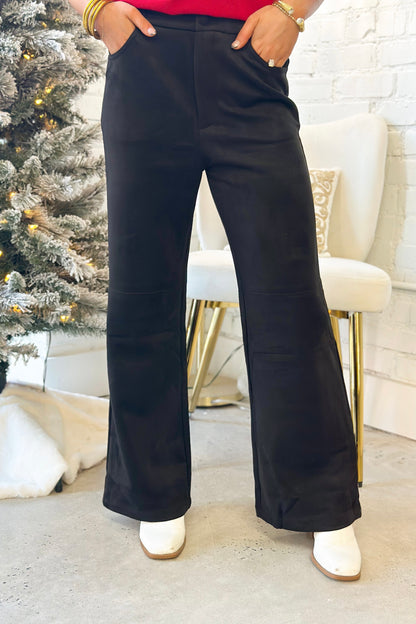Black suede straight-leg pants with front pockets and relaxed wide fit