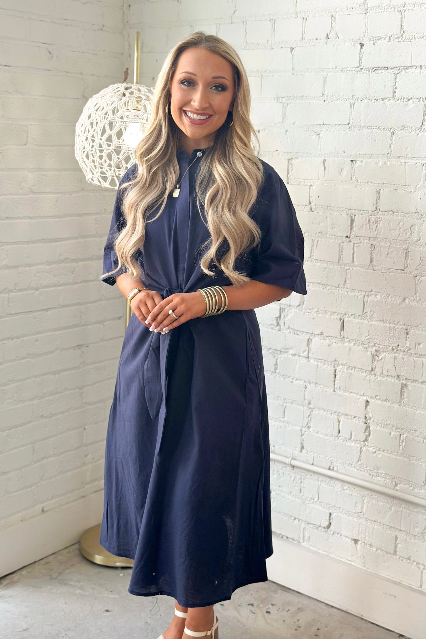 Twist tie waist detail on a navy midi dress