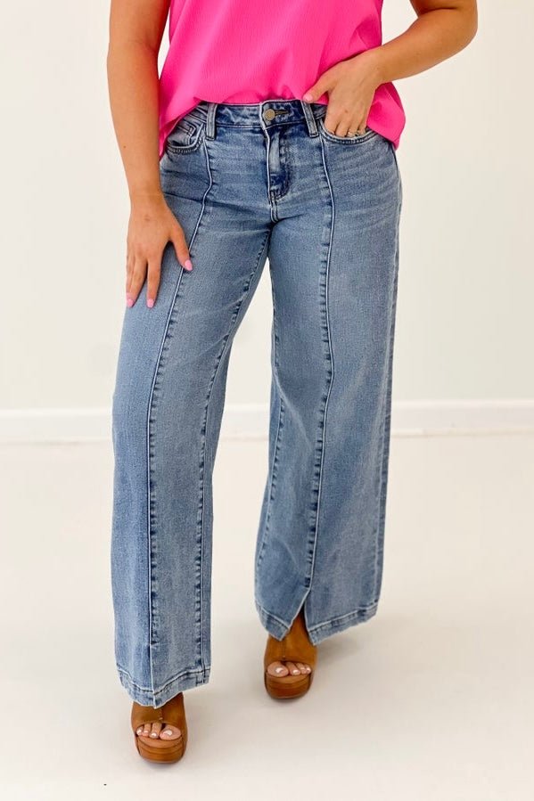 Mid rise jeans with slit detail at the hem