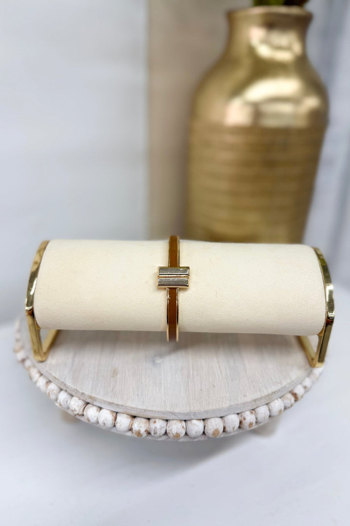 Brown color-coated bangle bracelet with gold trim