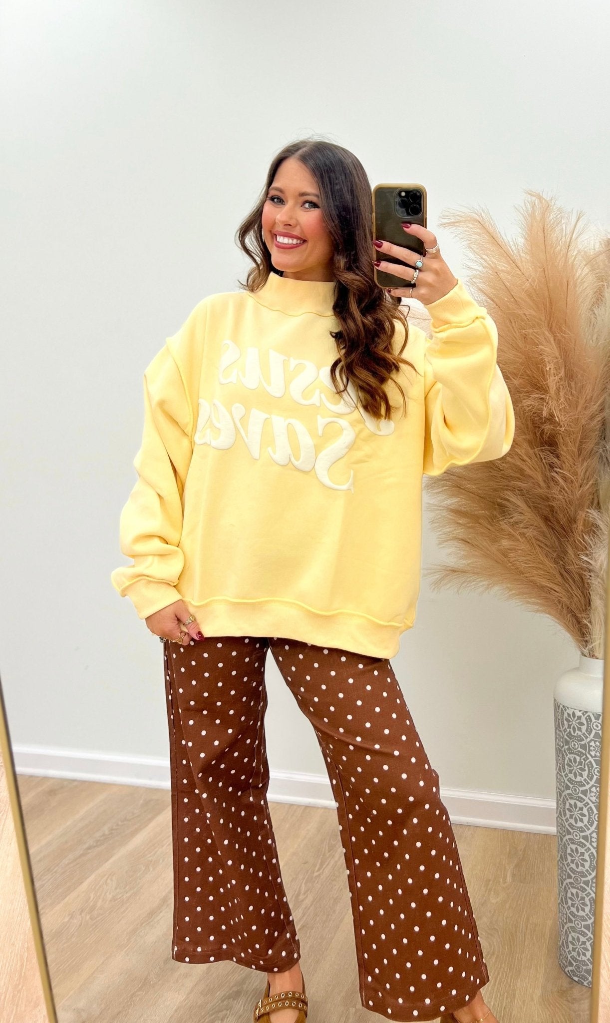 Mock neck pullover with a printed faith slogan