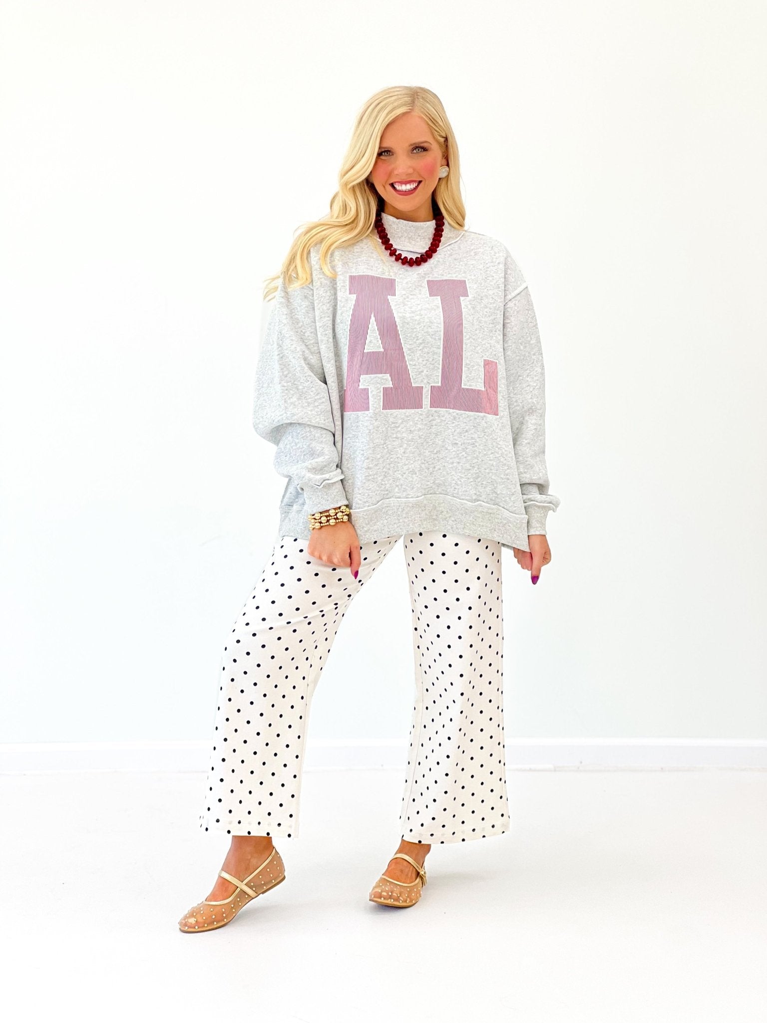 Mock neck pullover with embroidered chest detail