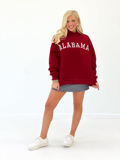 Mock neck crimson sweatshirt with a chest print