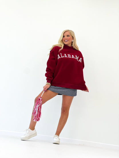 Crimson sweatshirt with ribbed cuffs and a mock neck