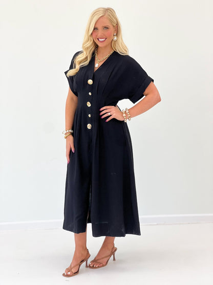 Black maxi dress with pintuck pleating and button detail