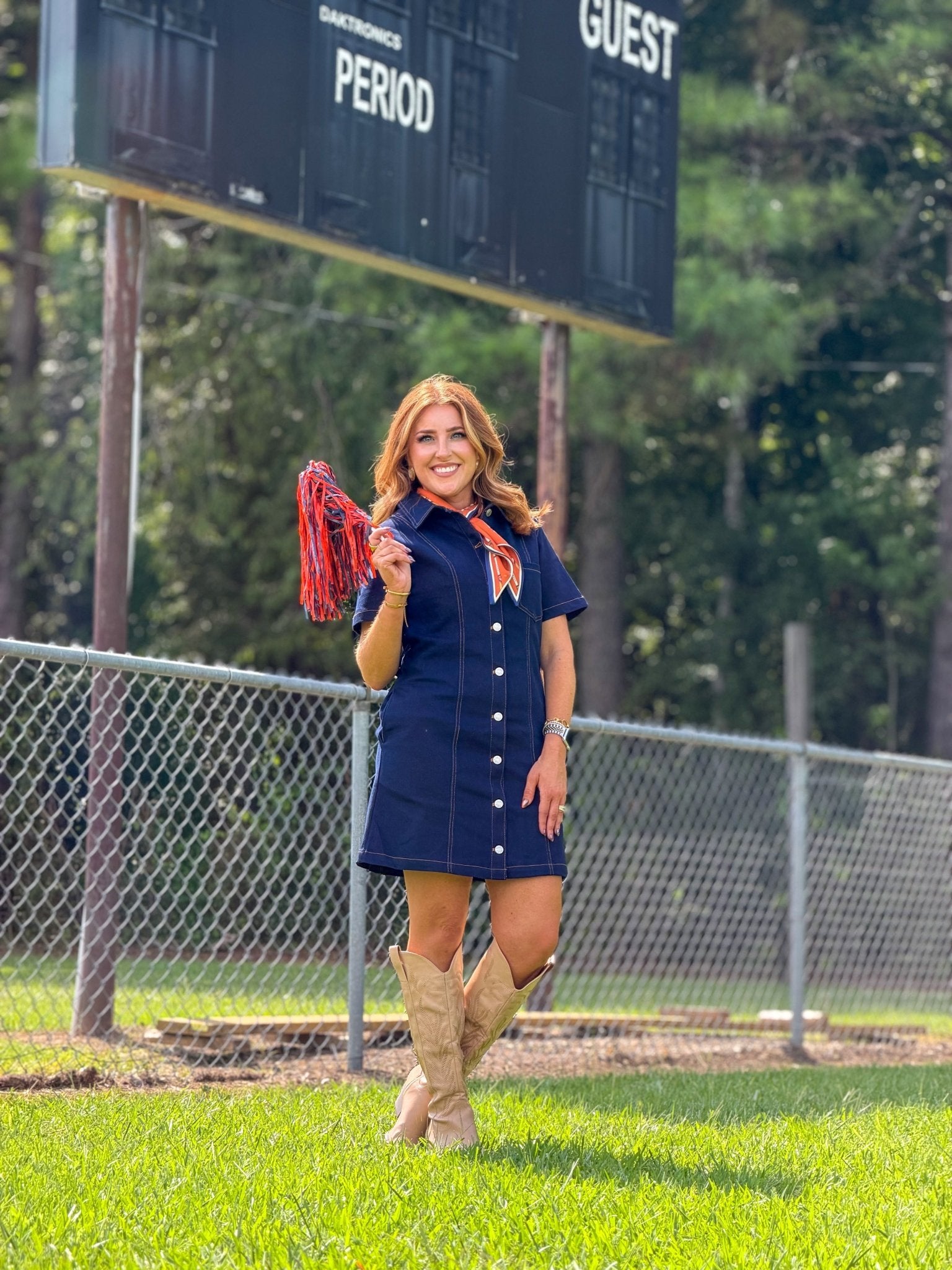 Tie waist detail on a dark denim button down dress
