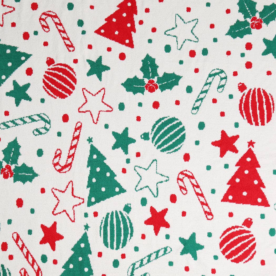 Cream throw blanket with red and green Christmas print