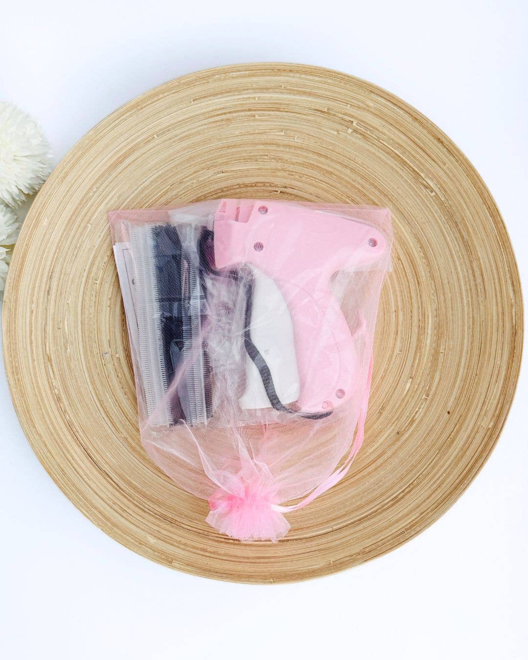 Pink Pocket Stitch tool and stitches inside a sheer organza travel bag