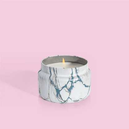 8.5oz marble tin candle in the Volcano fragrance