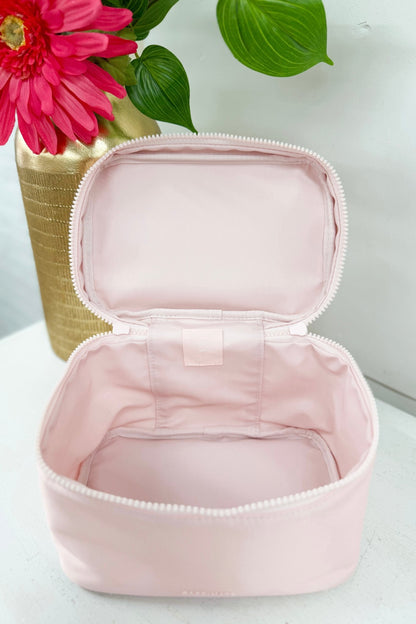 Pink structured train case for cosmetics