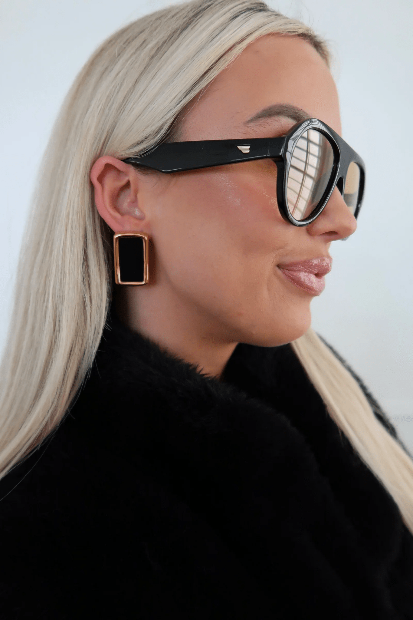 Black drop earrings on gold-tone posts