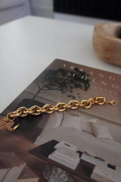 Slim gold chain bracelet with a clasp