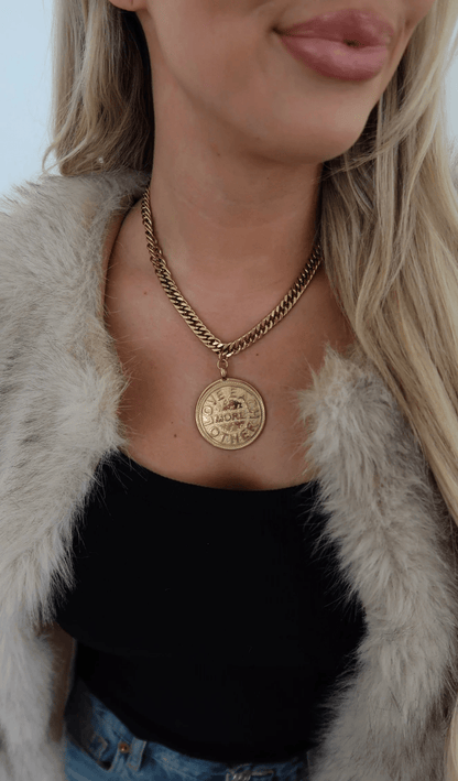 Gold chain necklace with a pendant drop