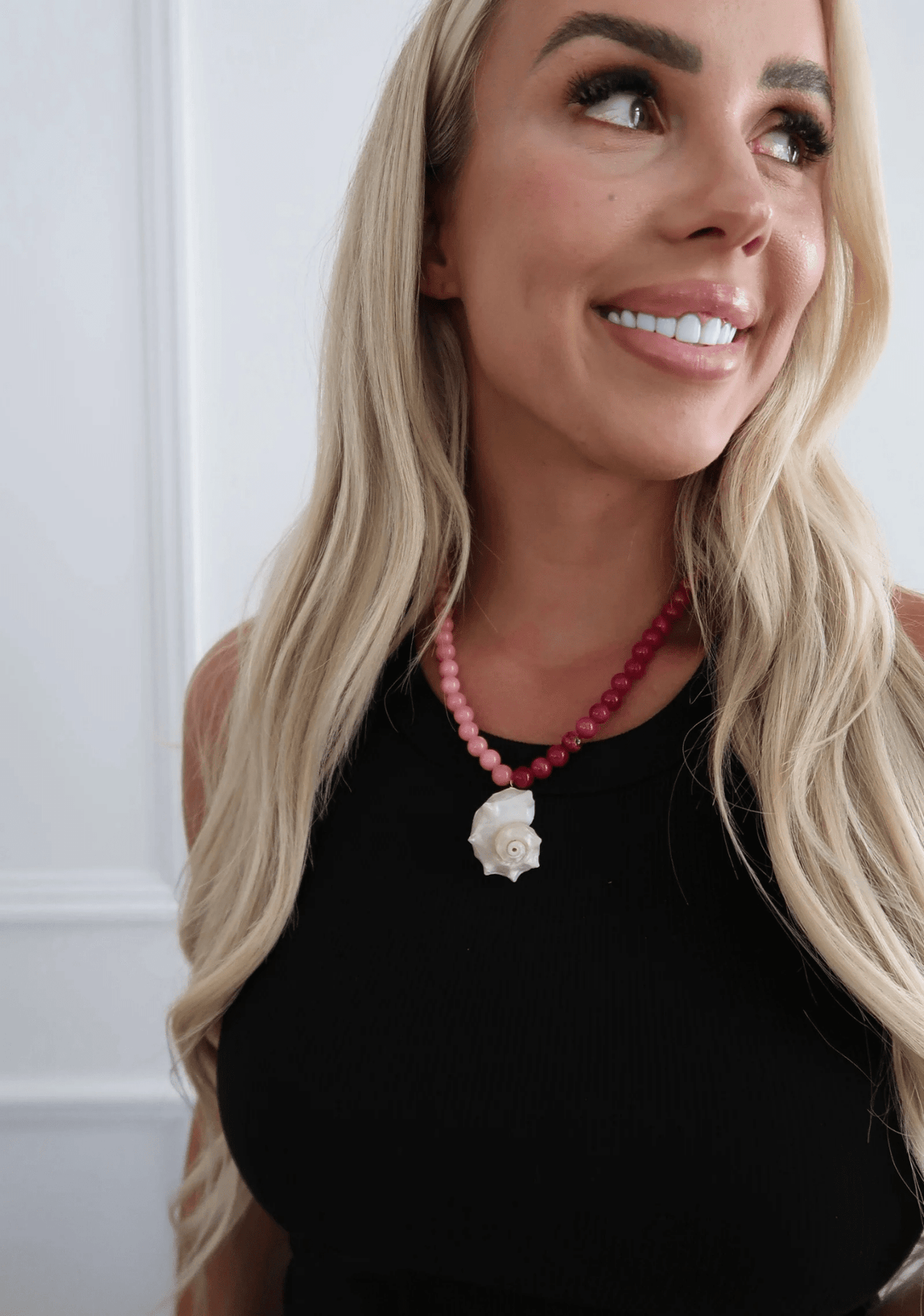 Pink shell necklace with a gold-tone chain