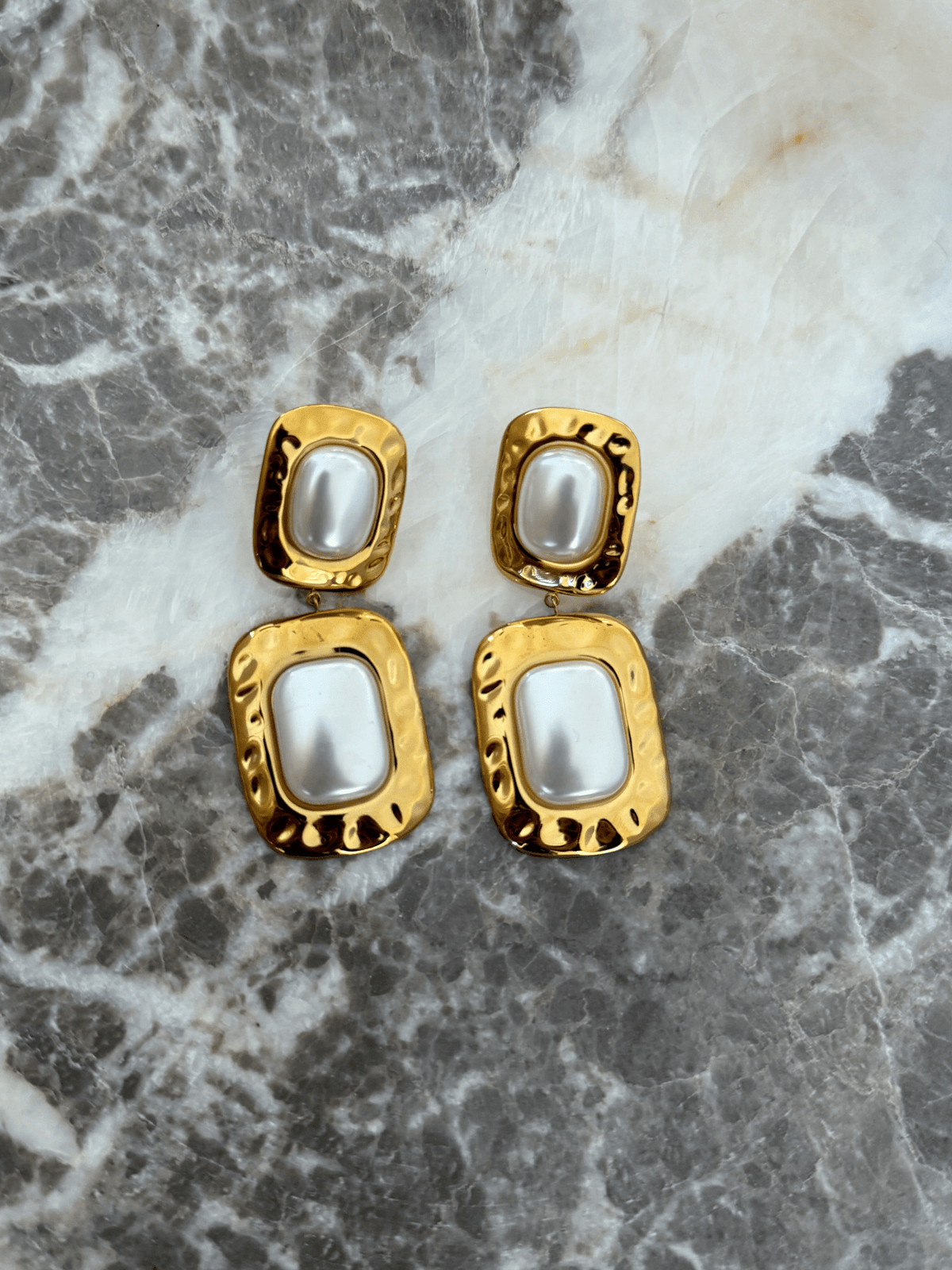 Gold drop earrings with a slim silhouette