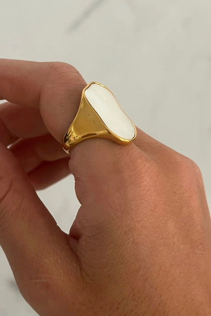 Gold statement ring with a raised center