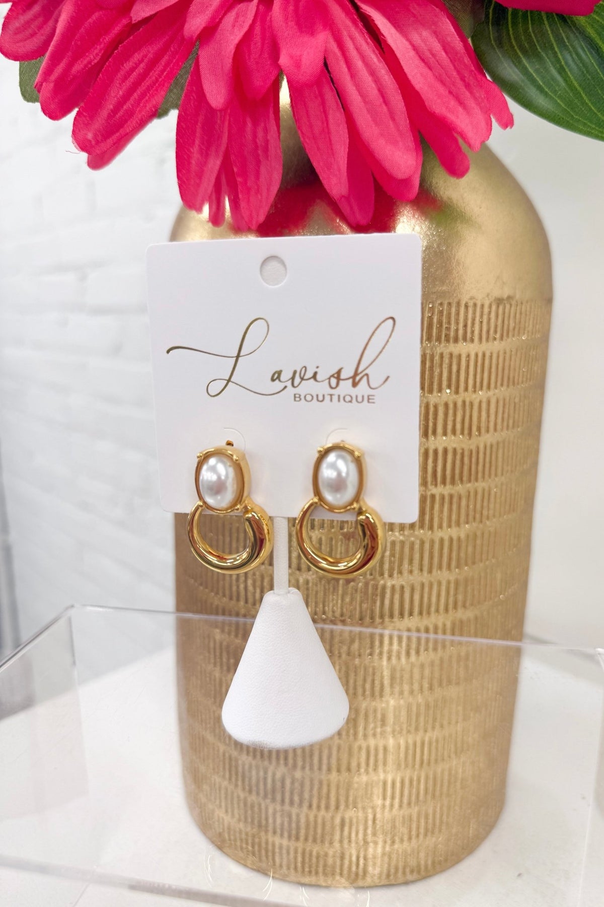 Round pearl studs in a circular setting