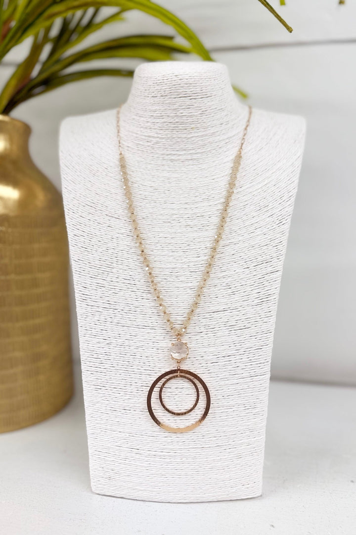 Natural bead necklace with two clear circle pendants