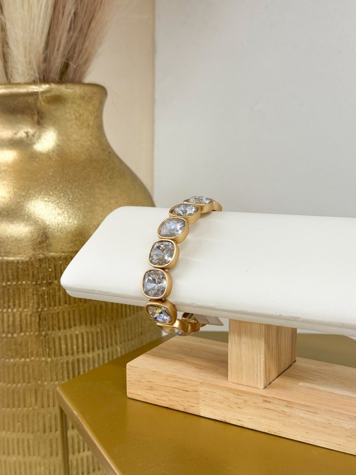 Clear cushion cut crystal accent bracelet in matte gold