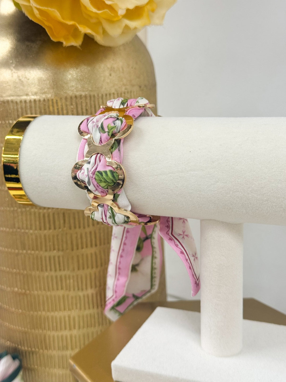 Fabric wrapped bracelet with a clover charm