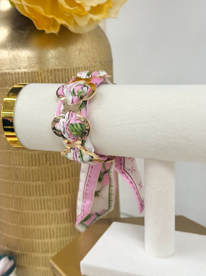 Fabric wrapped bracelet with a clover charm