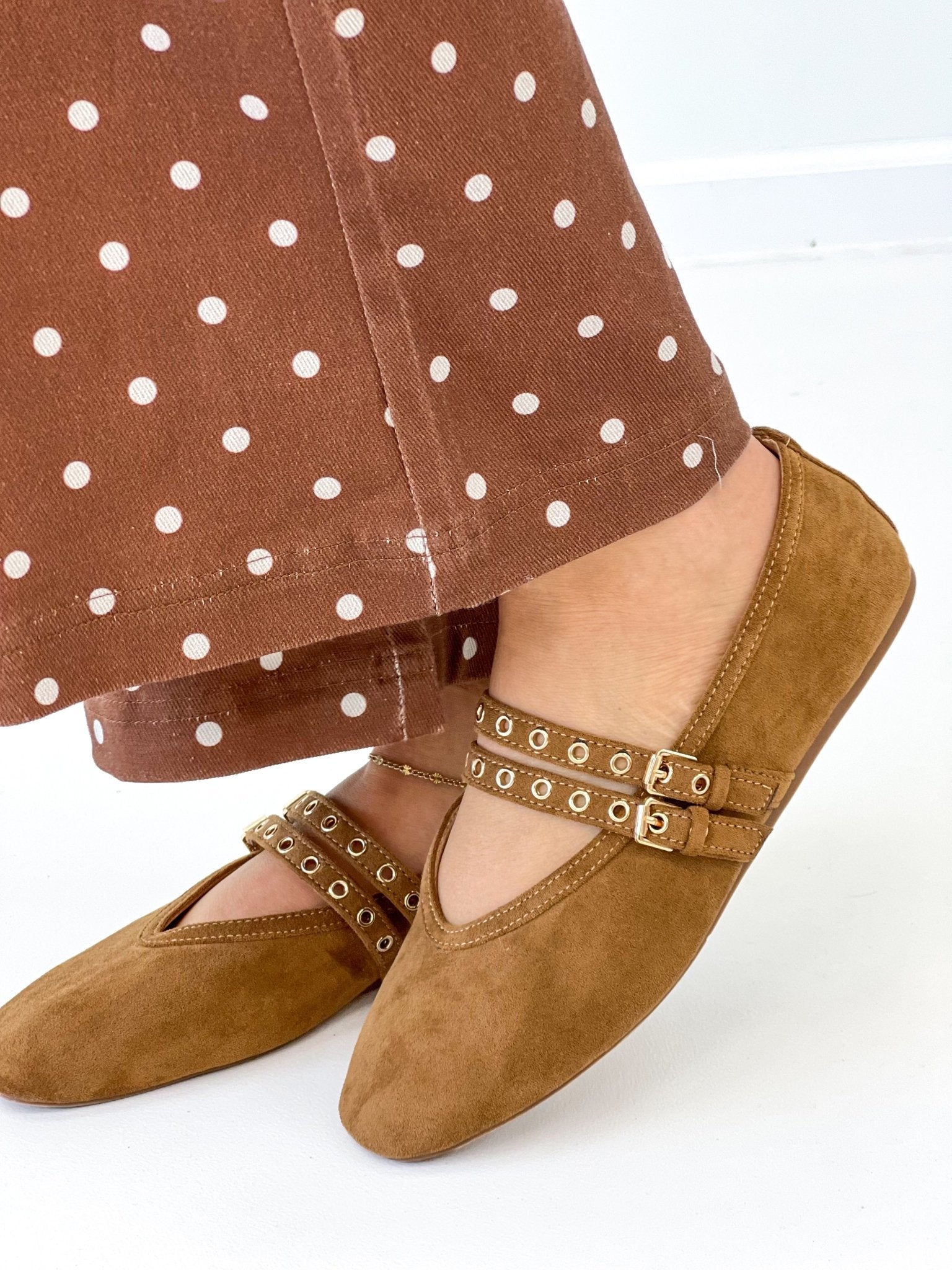Camel faux suede Mary Jane flats with studded ankle strap and buckle, worn