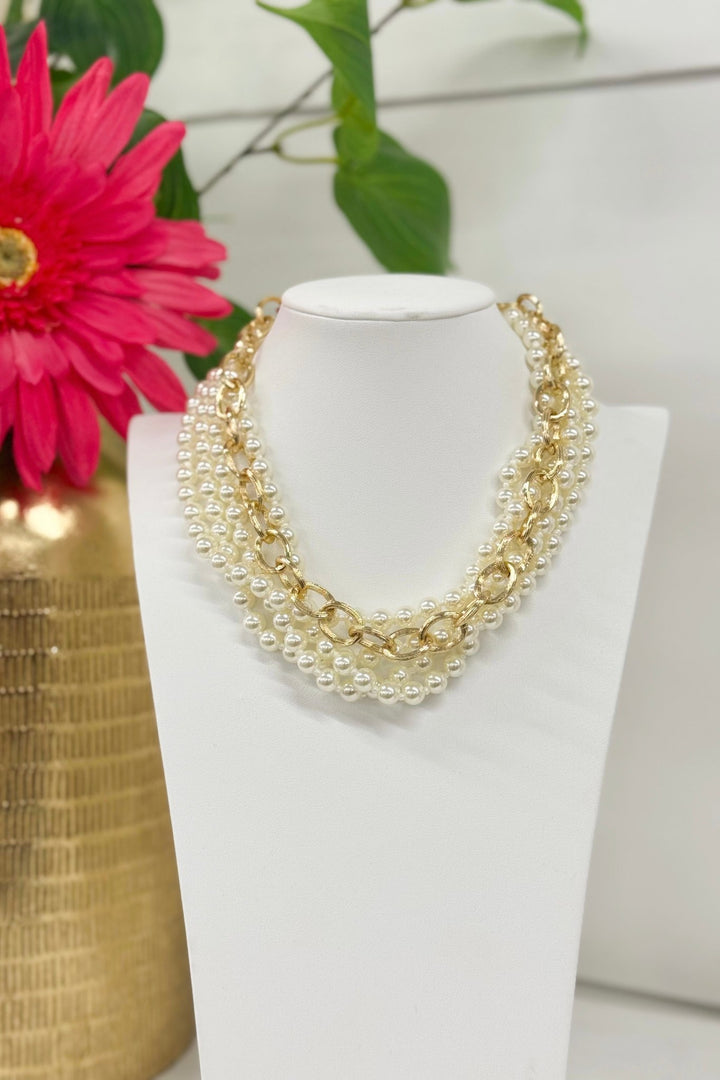 Cream pearl necklace in four gold-accented layers