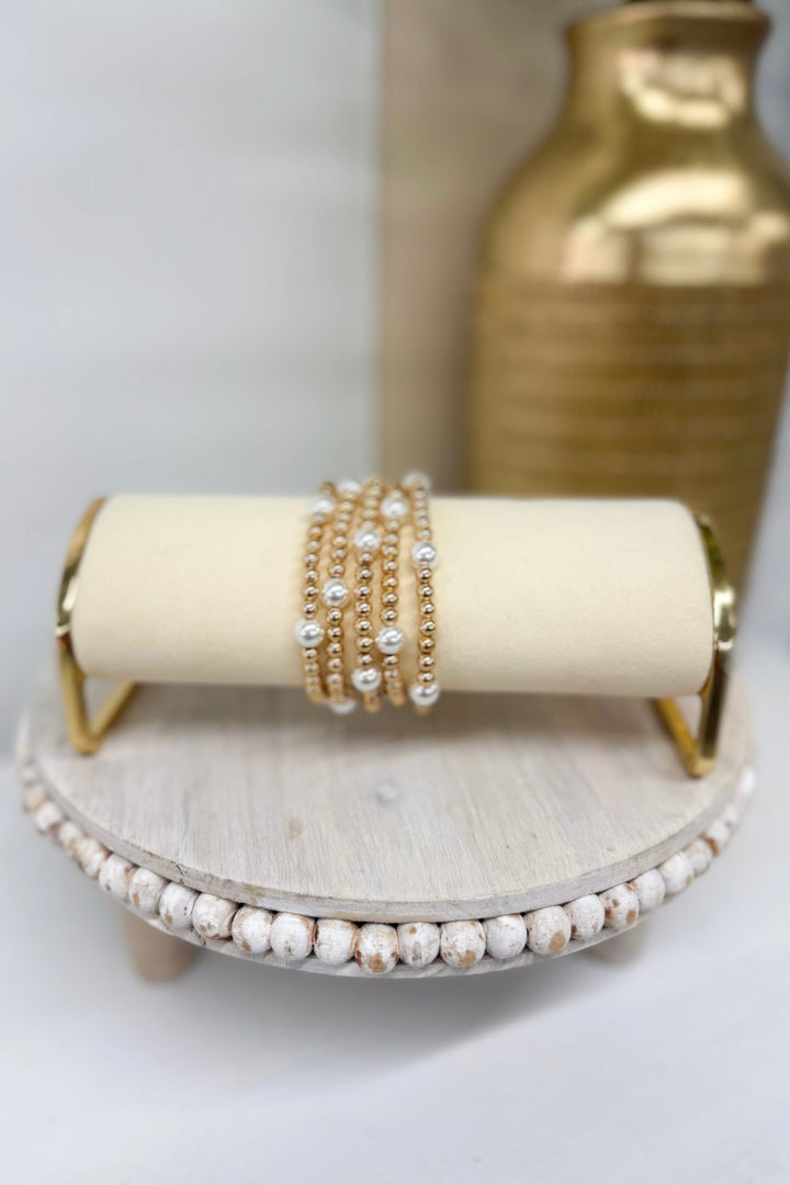 Five-row cream pearl station bead bracelet in gold