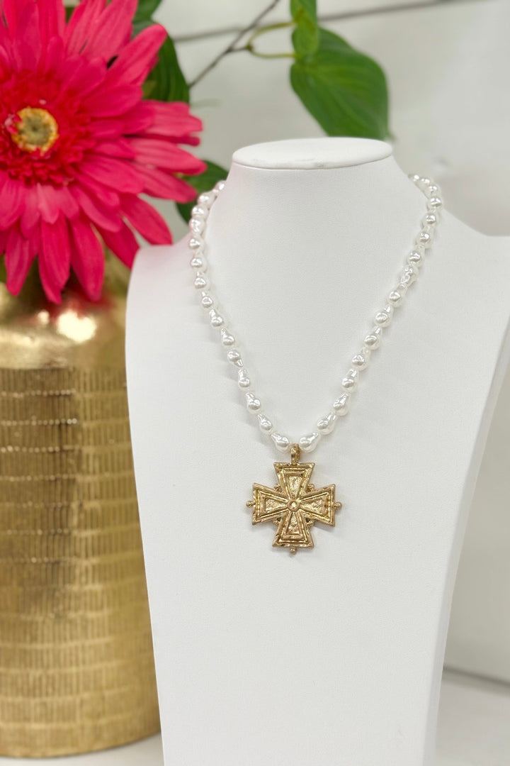 Cream baroque pearl necklace with a vintage gold cross