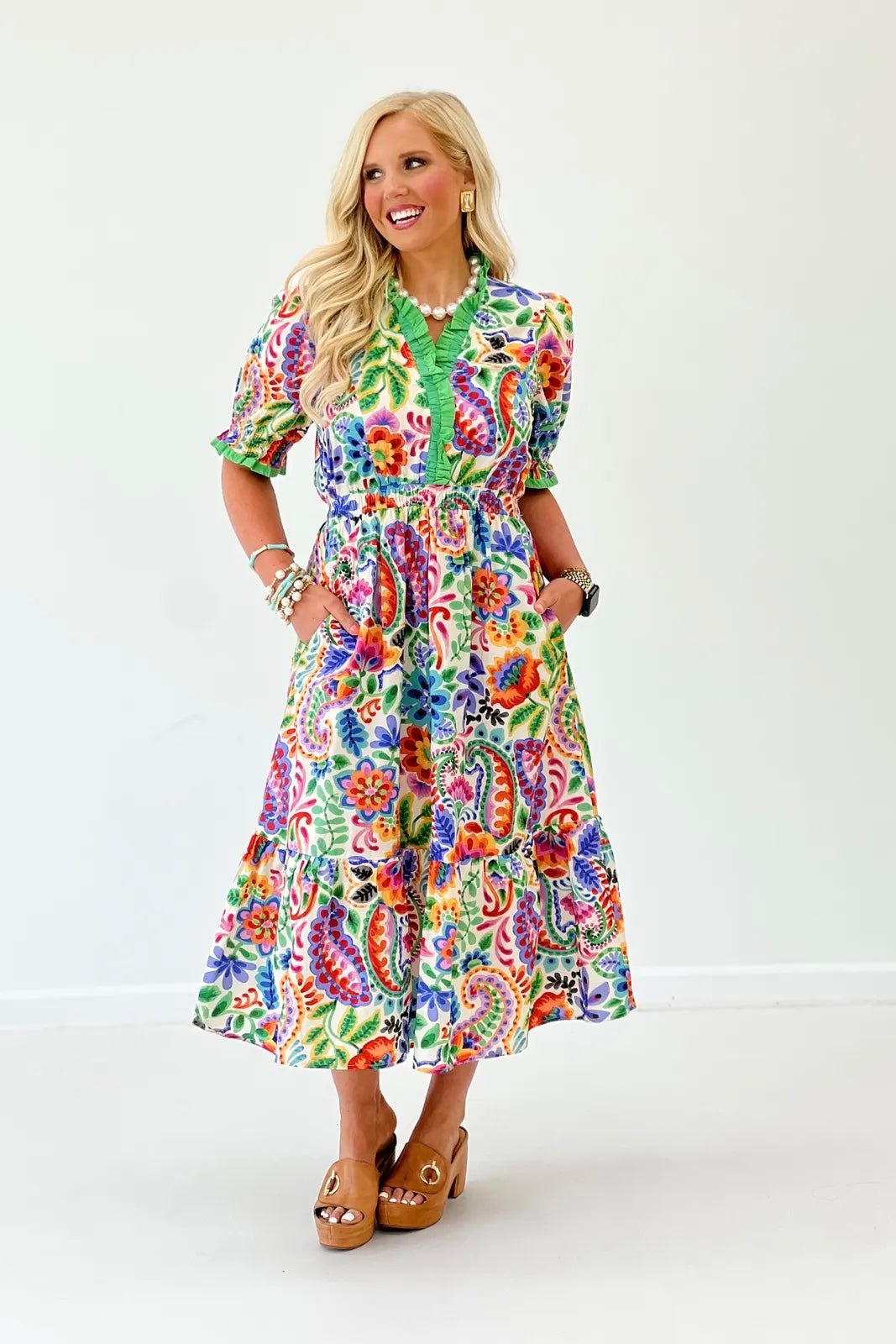Floral midi dress on a cream base with a flowing skirt
