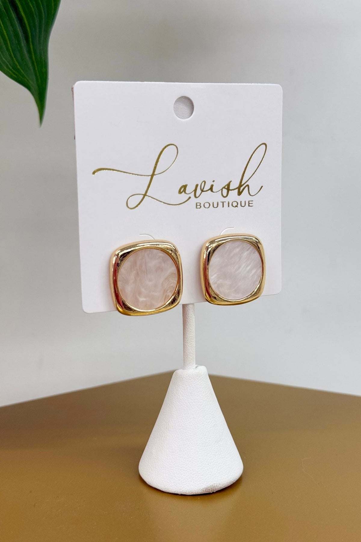 Cream pearl earrings pairing square and round shapes