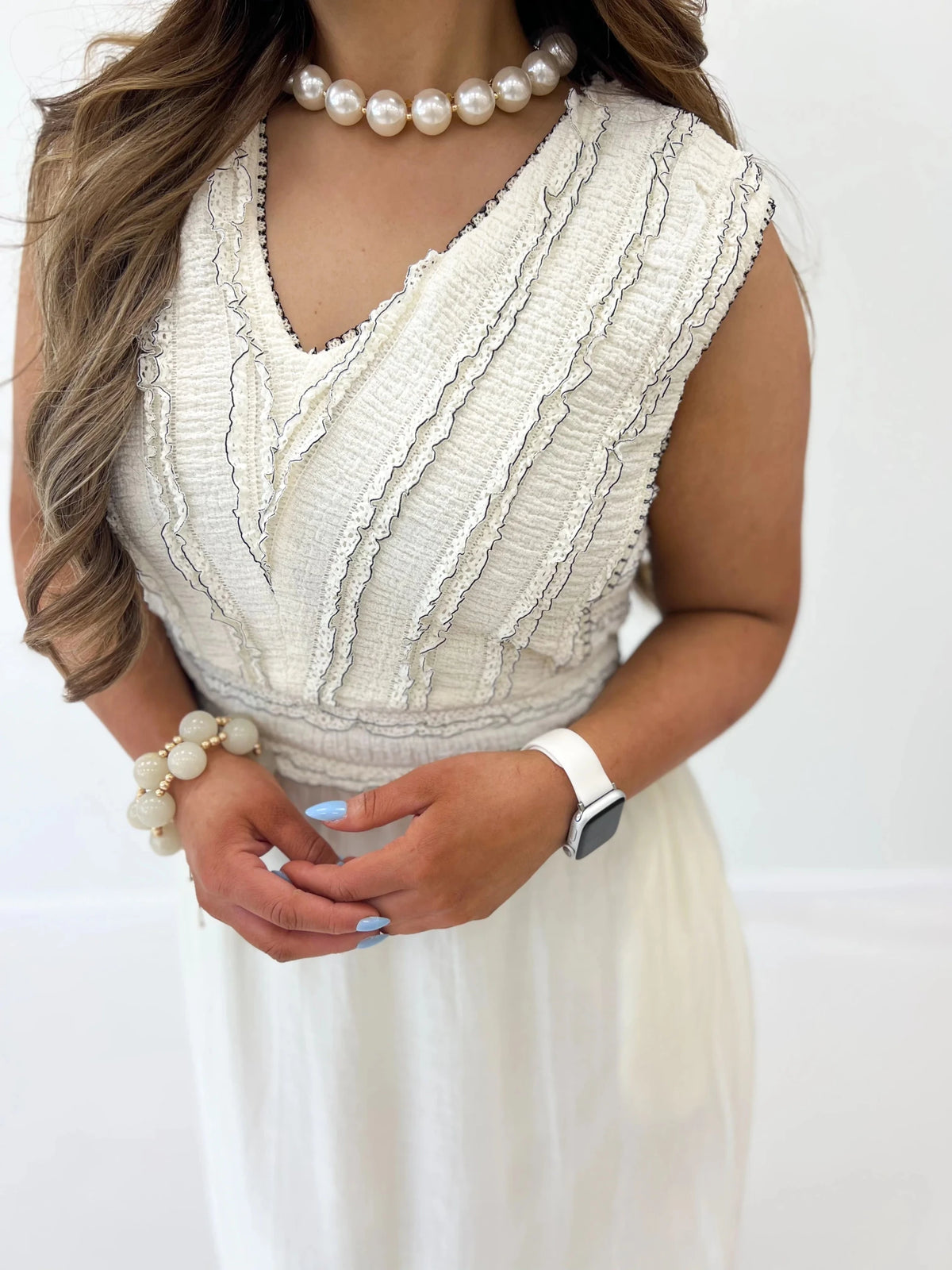 Cream and black midi dress with a flared skirt