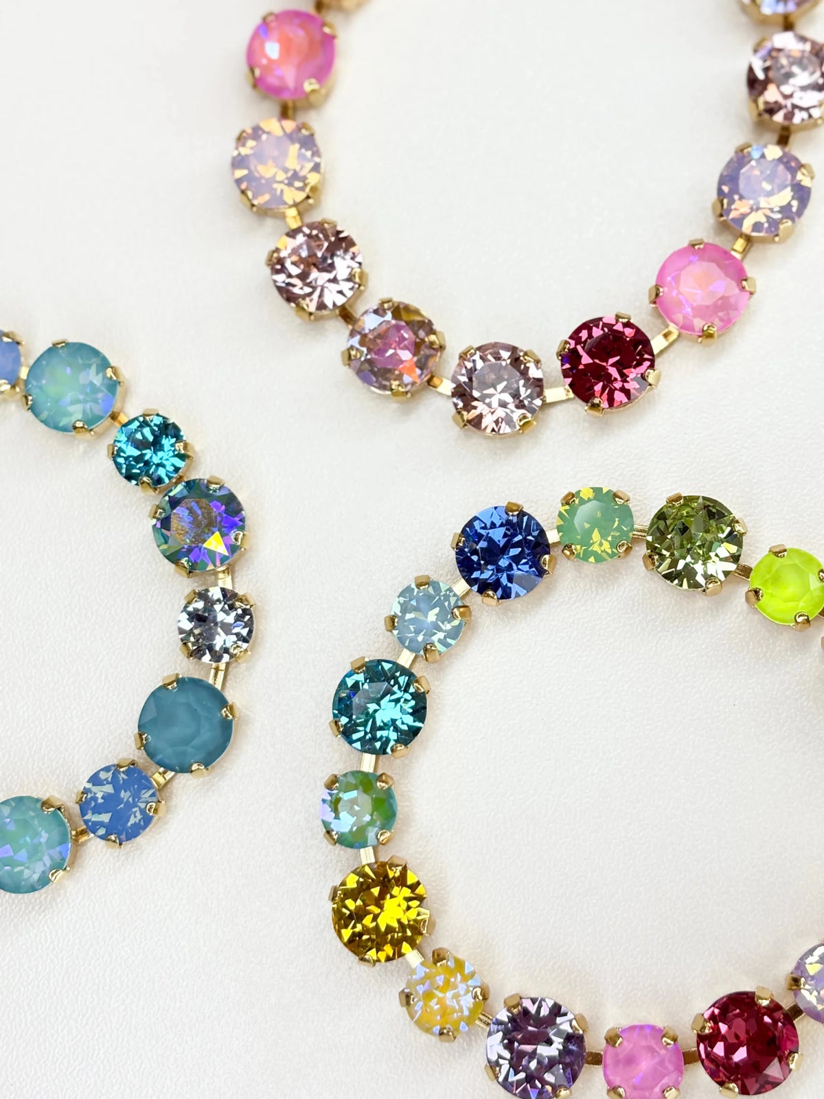 Gold-tone bracelet strung with multicolor crystal gemstone beads