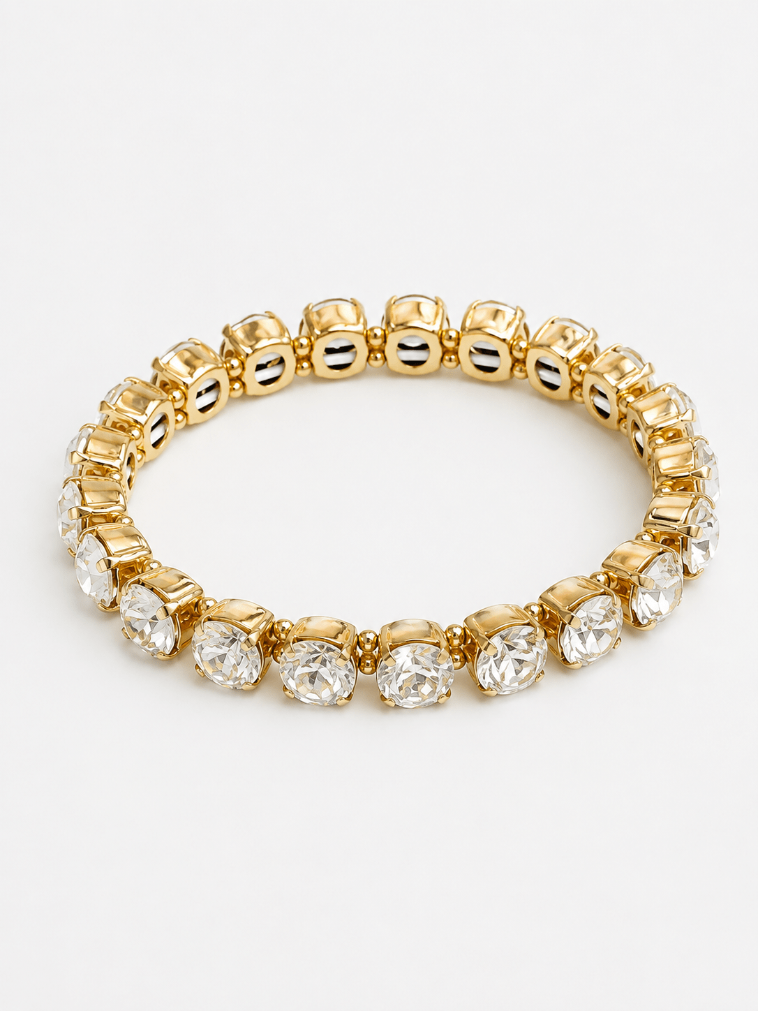 Clear crystal beads strung on a gold-tone bracelet
