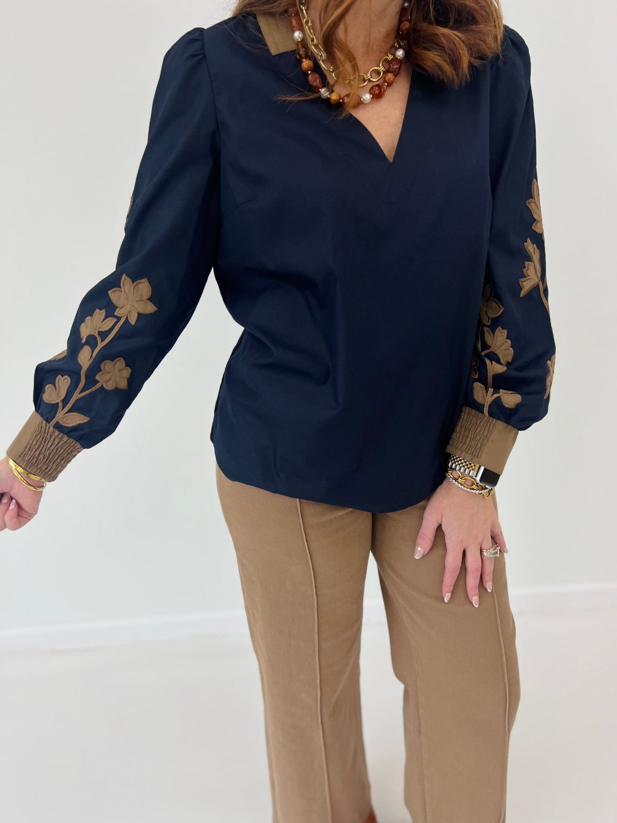 Navy blouse with a stitched v-neckline