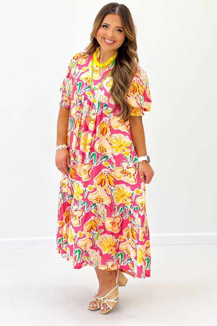 Pink Multi floral printed dress. Styled with heels and chunky jewelry.