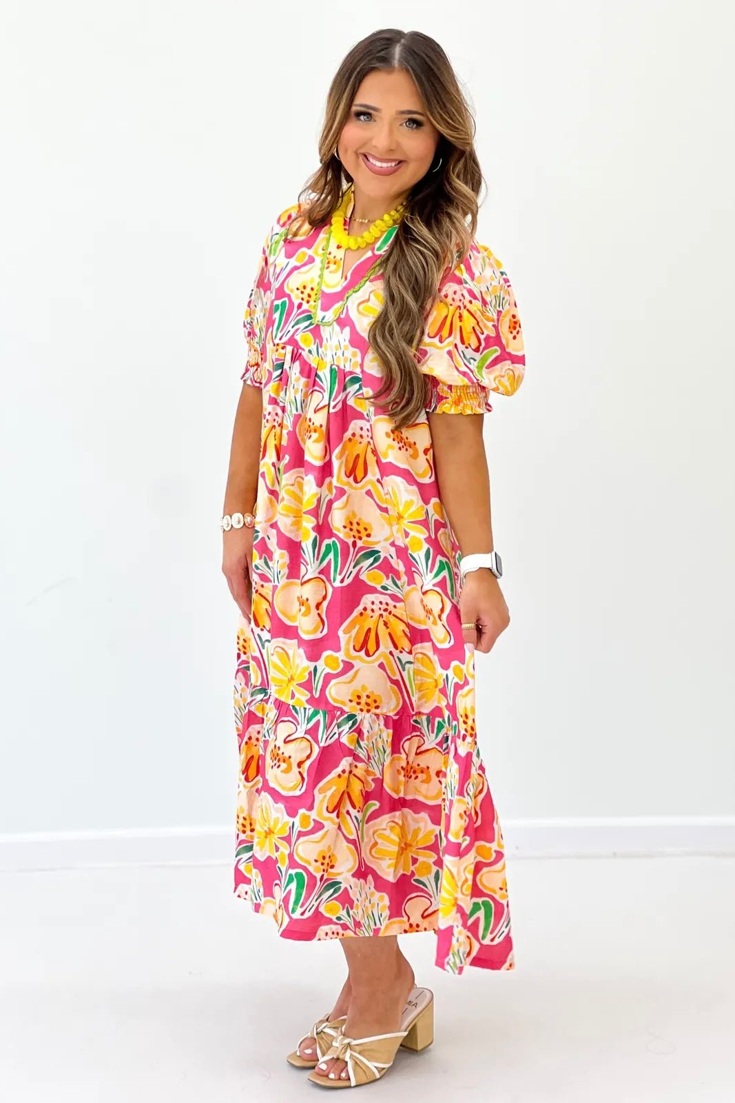 Pink Multi floral printed dress. Styled with heels and chunky jewelry.