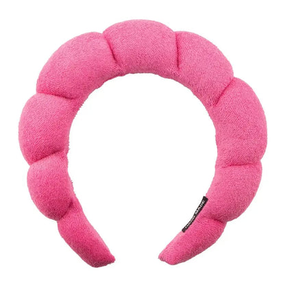 Hot pink padded spa headband with segmented plush sections