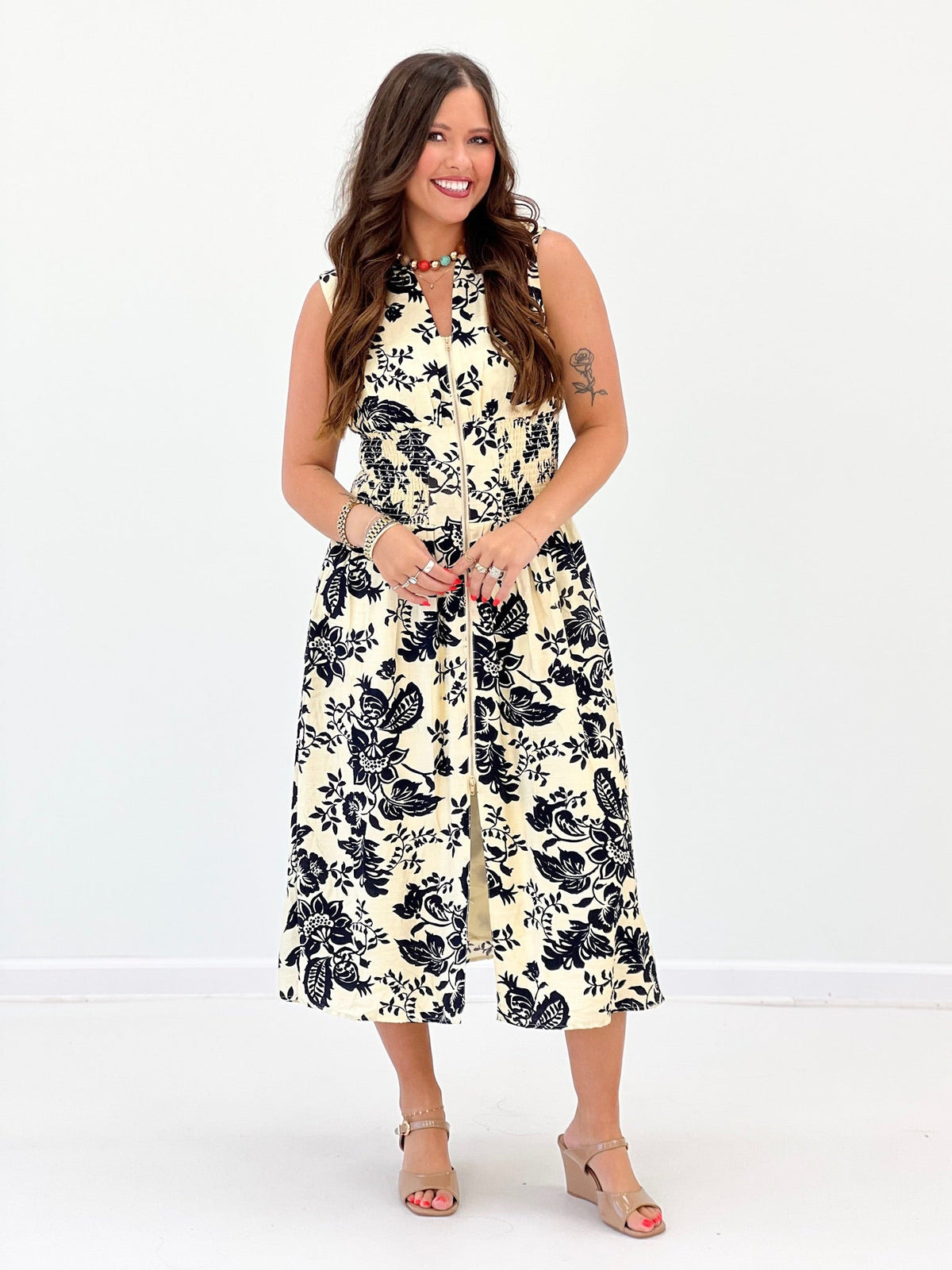 Ivory and navy paisley dress with a V-neck and zip detail