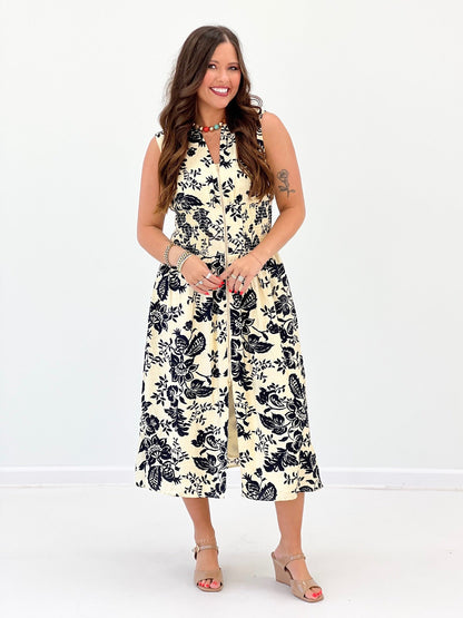 Ivory and navy paisley dress with a V-neck and zip detail