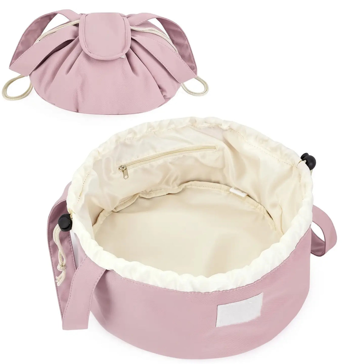 Dusty rose barrel makeup bag with drawstring closure, handles, and cream-lined interior
