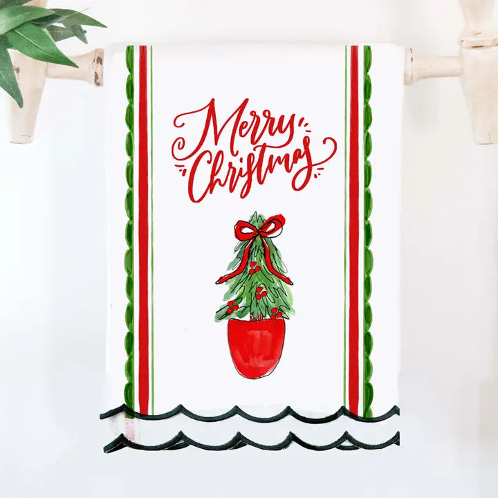 Christmas scallop tea towel with "Merry Christmas" text, red ornament and scalloped trim