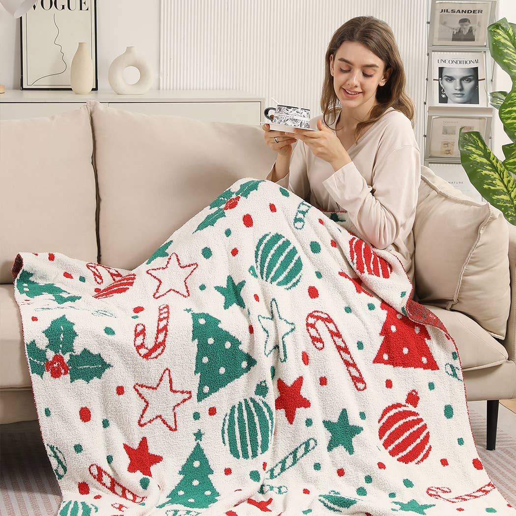 Cream throw blanket with red and green Christmas print