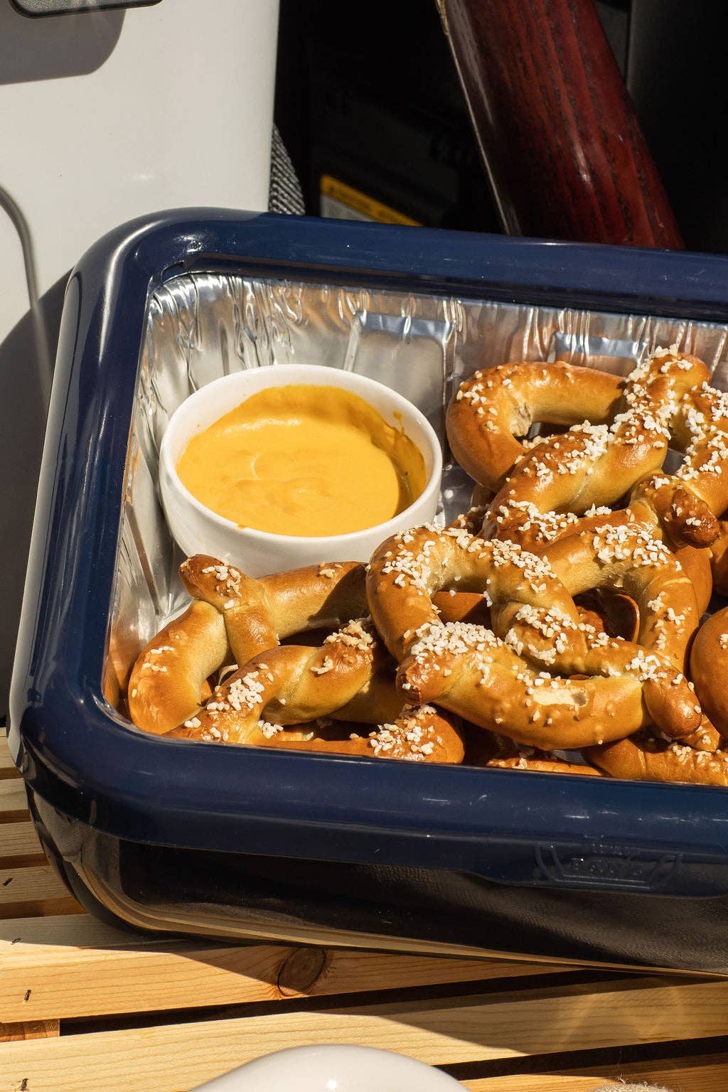 Navy foil pan carrier holding a foil-lined tray filled with food