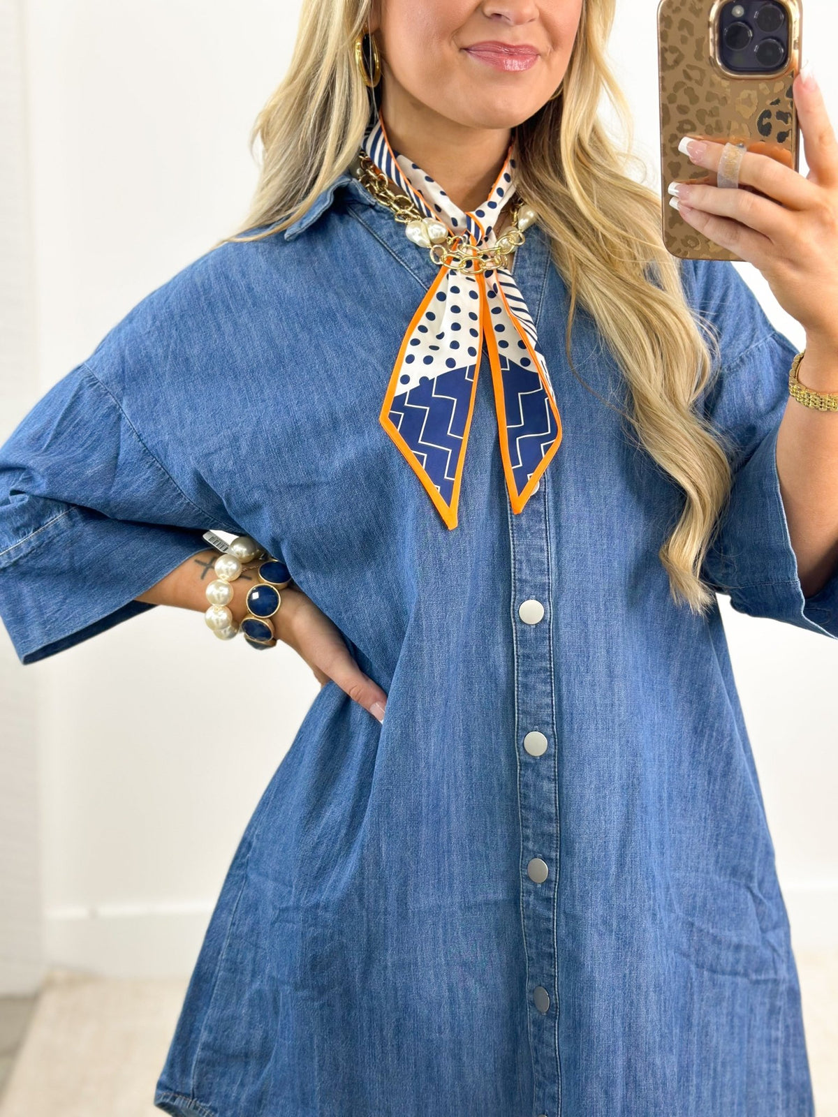 Denim dress fastened with buttons down the front